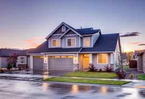 Elegant suburban home with driveway at sunset showcasing modern architecture.